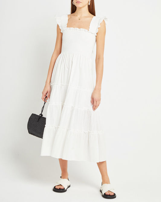 Third image of Calypso Maxi Dress, a white maxi dress, swiss dot material, smocked bodice, ruffles cap sleeves