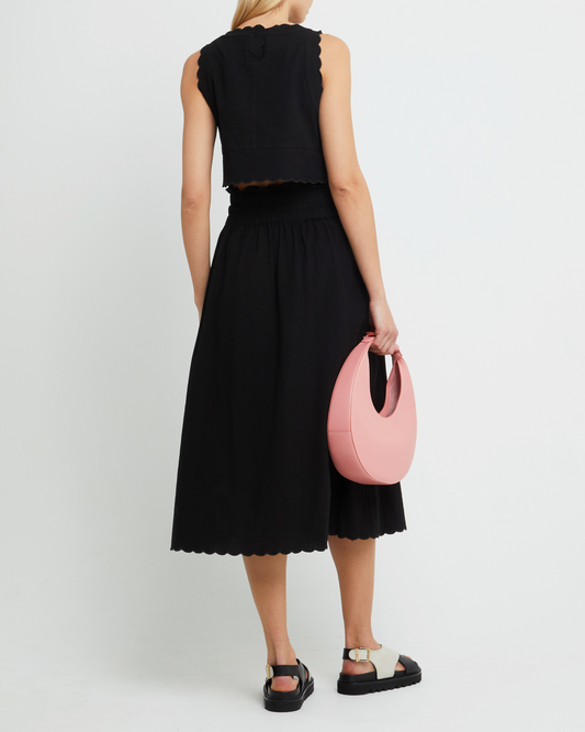 Second image of Chelsea Set, a black top and midi skirt, linen, elastic, scalloped hem, high neck