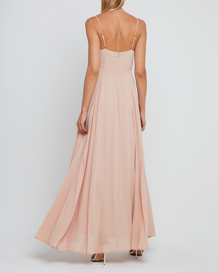 Second image of Winslow Dress, a pink bridesmaid dress with pleated cup detail, bustier style bodice, long flowy skirt, side slit, back zipper, adjustable straps, lining, and sweetheart neckline