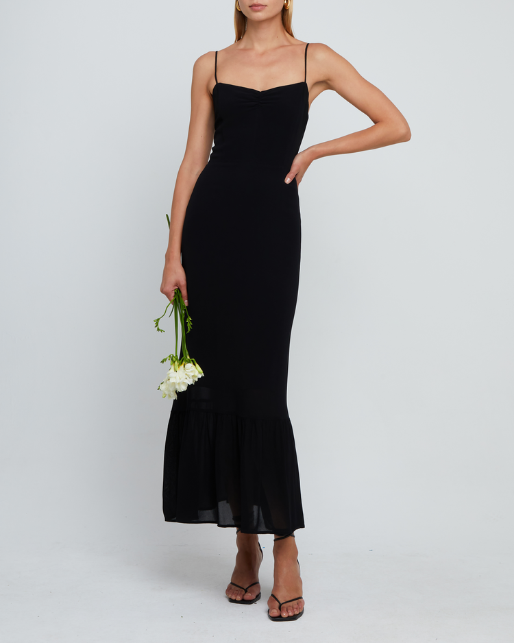 Sixth image of Evelyn Dress, a black bridesmaid maxi-length dress with ruched bust detail, sweetheart neckline, tiered skirt, back smocking, adjustable straps, back zipper, and lining