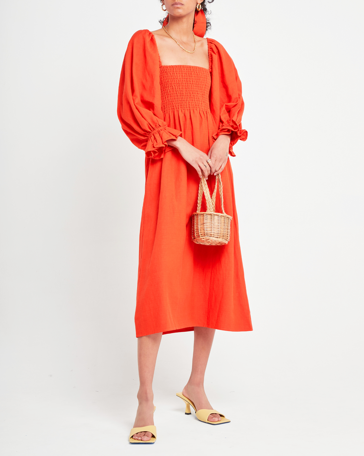 First image of Athena Dress, a orange midi dress, long puff sleeves, smocked, square neckline