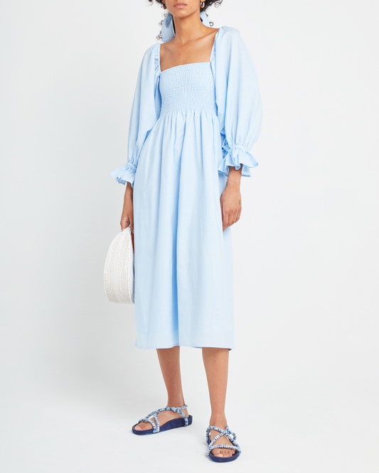 First image of Athena Dress, a blue midi dress, off shoulder, long sleeve, puff sleeves, smocked