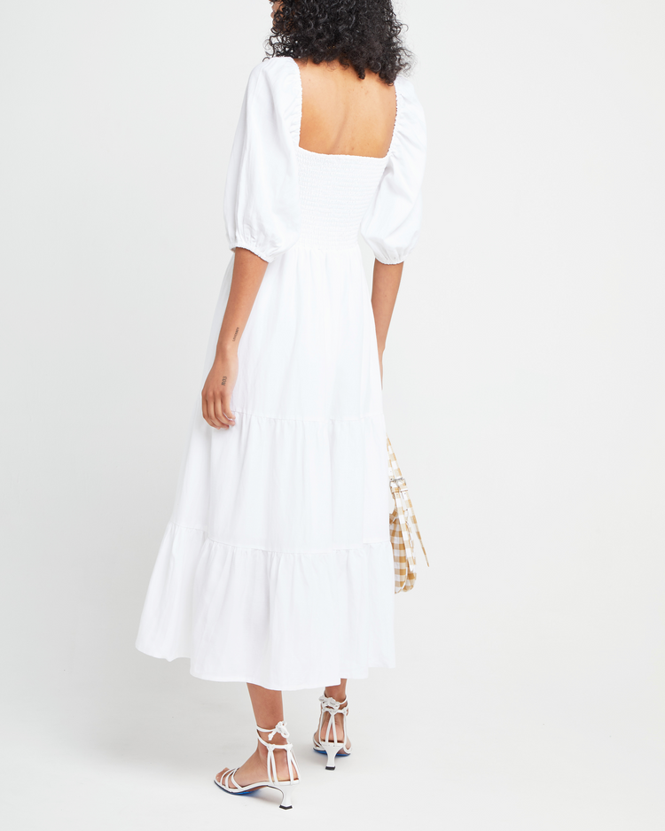 Second image of Hera Dress, a white midi dress, smocked bodice, puff sleeves, short sleeves