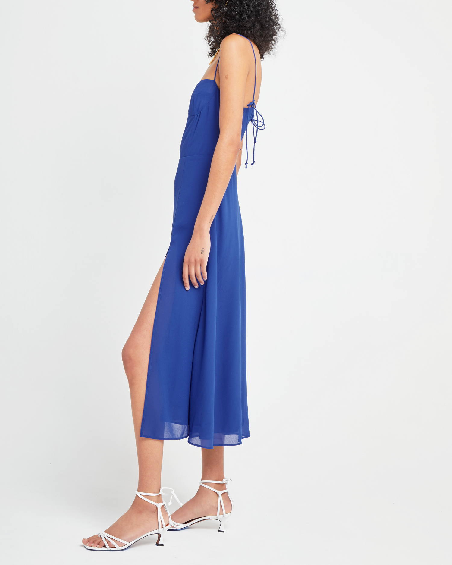 Third image of Venus Dress, a blue midi dress, tie straps, spaghetti straps, side slit, bodice