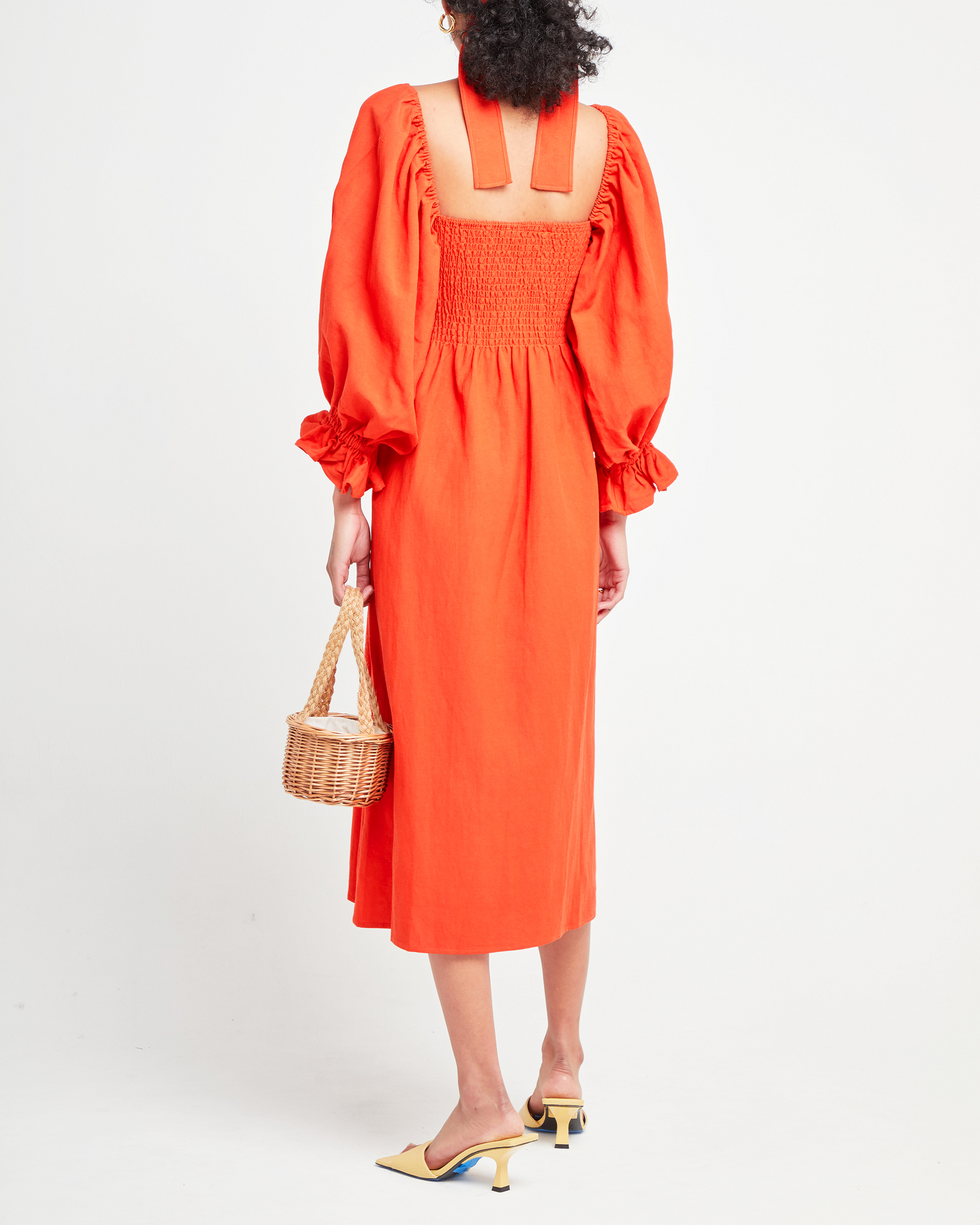 Second image of Athena Dress, a orange midi dress, long puff sleeves, smocked, square neckline