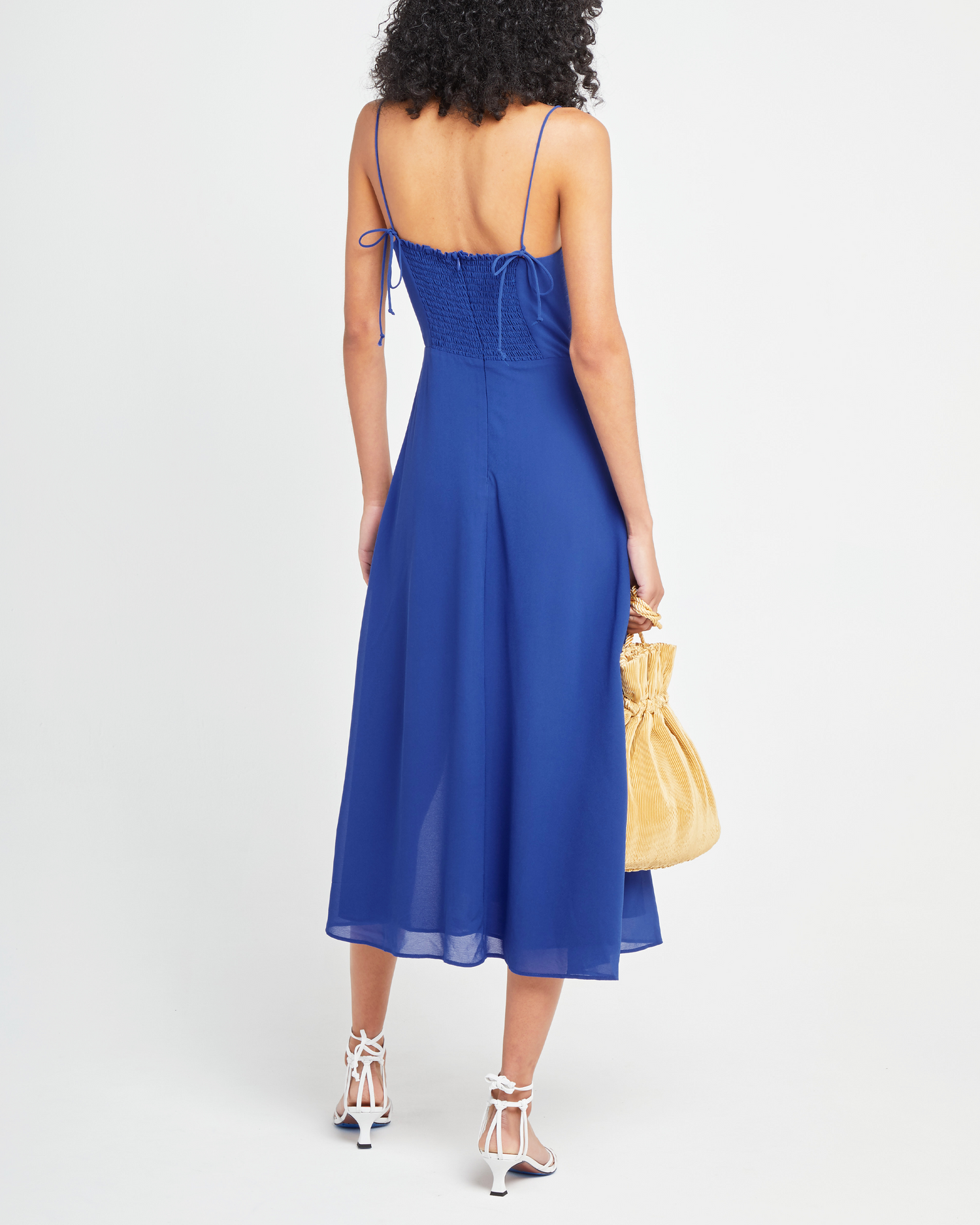 Second image of Venus Dress, a blue midi dress, tie straps, spaghetti straps, side slit, bodice