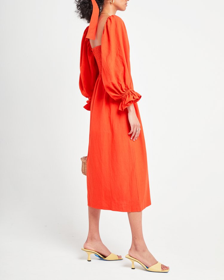 Third image of Athena Dress, a orange midi dress, long puff sleeves, smocked, square neckline