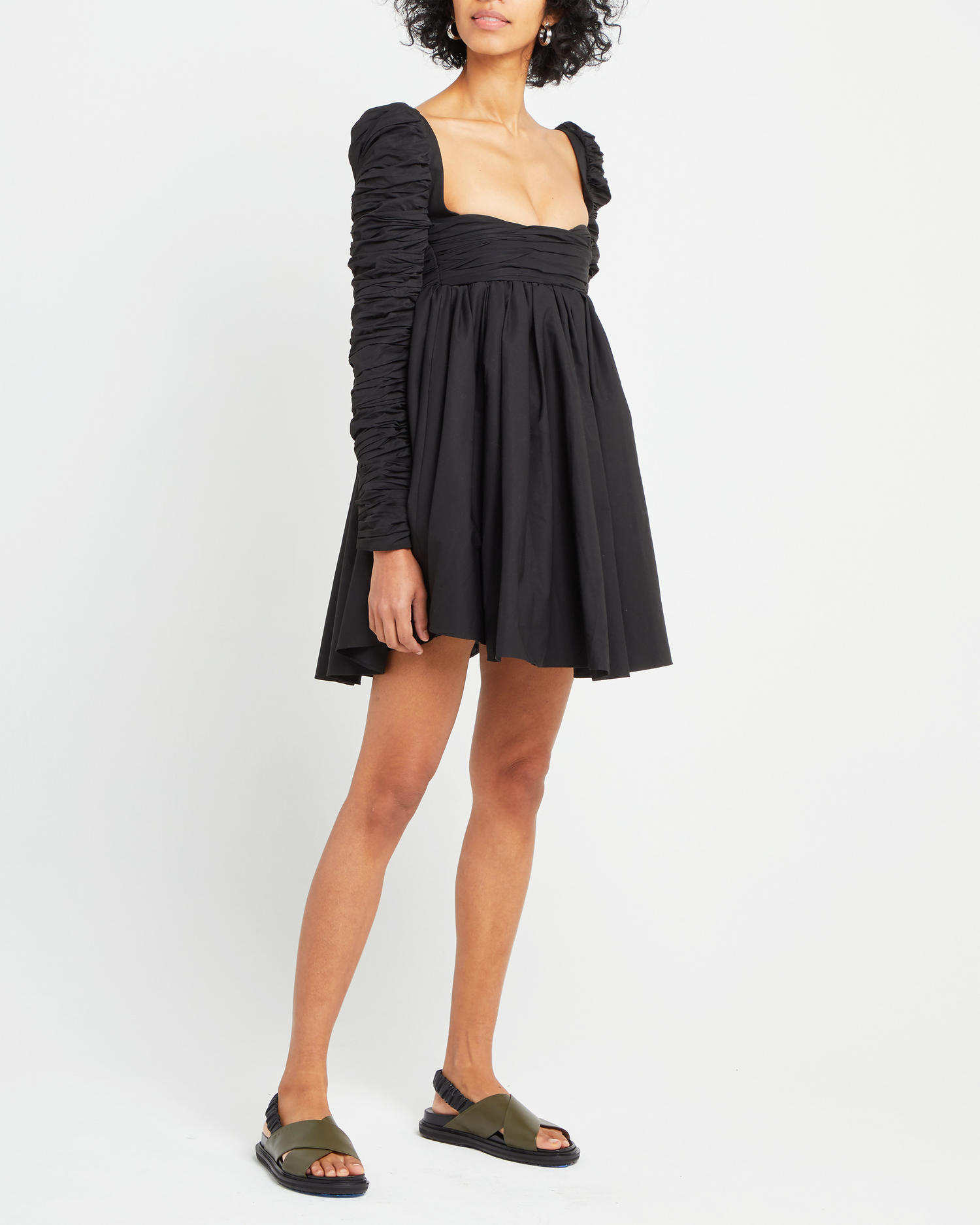 Third image of Structured Long-Sleeve Frock, a black mini dress, babydoll silhouette, long ruched sleeves, square neckline