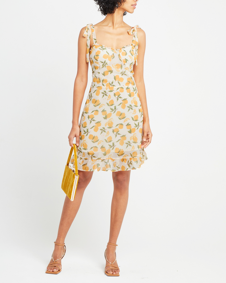Sixth image of Sunny Dress, a yellow mini dress, ruffle, ribbon, tie straps, ribbon, bows, lemon print