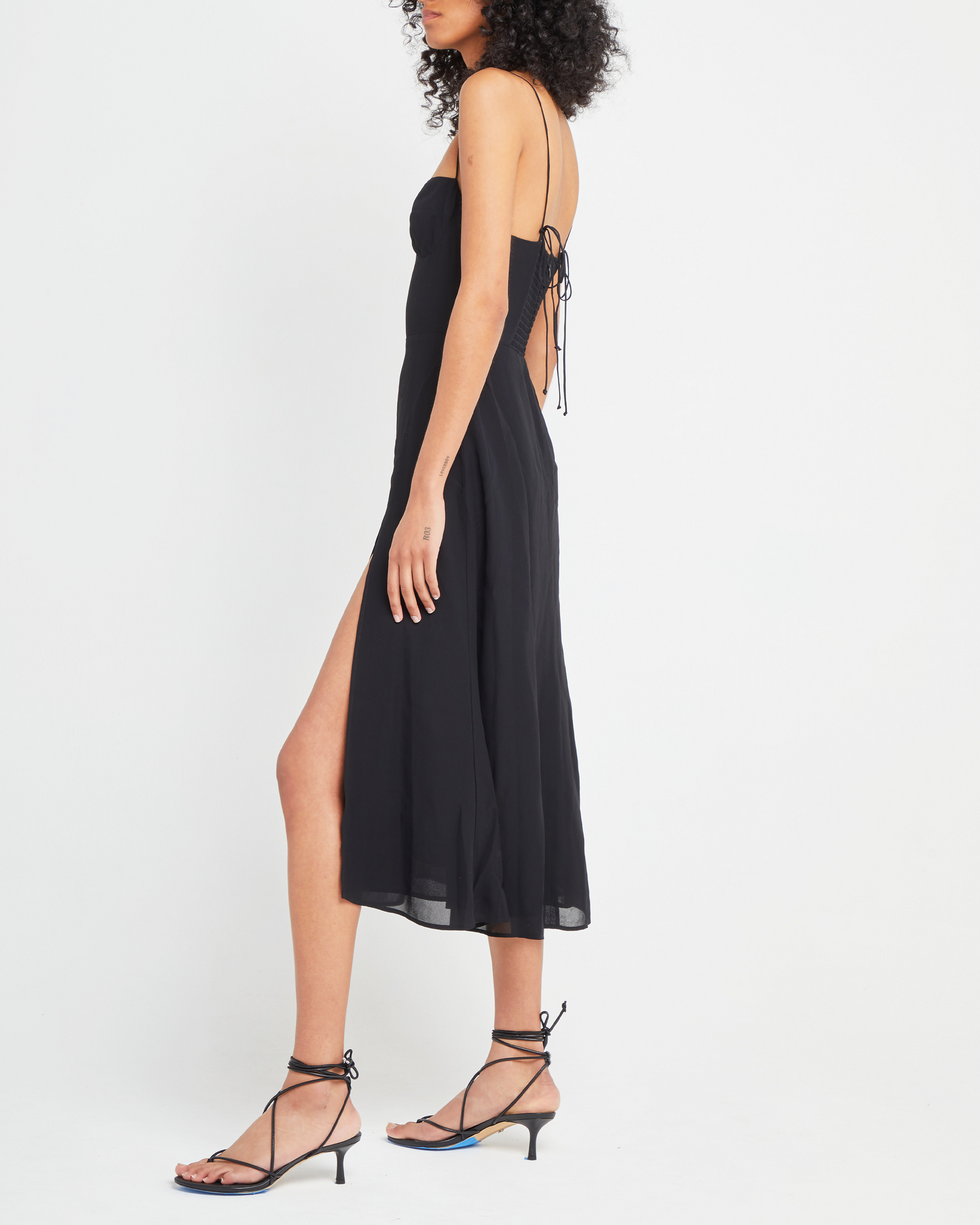 Fourth image of Venus Dress, a black midi dress, tie straps, spaghetti straps, side slit, bodice