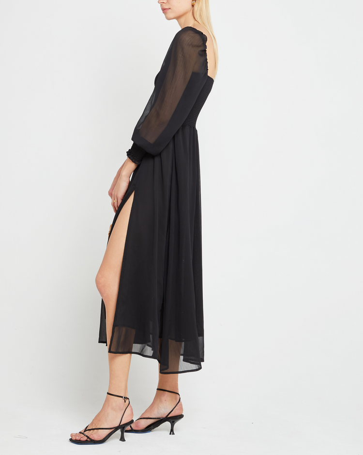 Fourth image of Classic Smocked Maxi Dress, a black maxi dress, side slit, long, sheer sleeves, puff sleeves, suqare neckline, smocke bodice