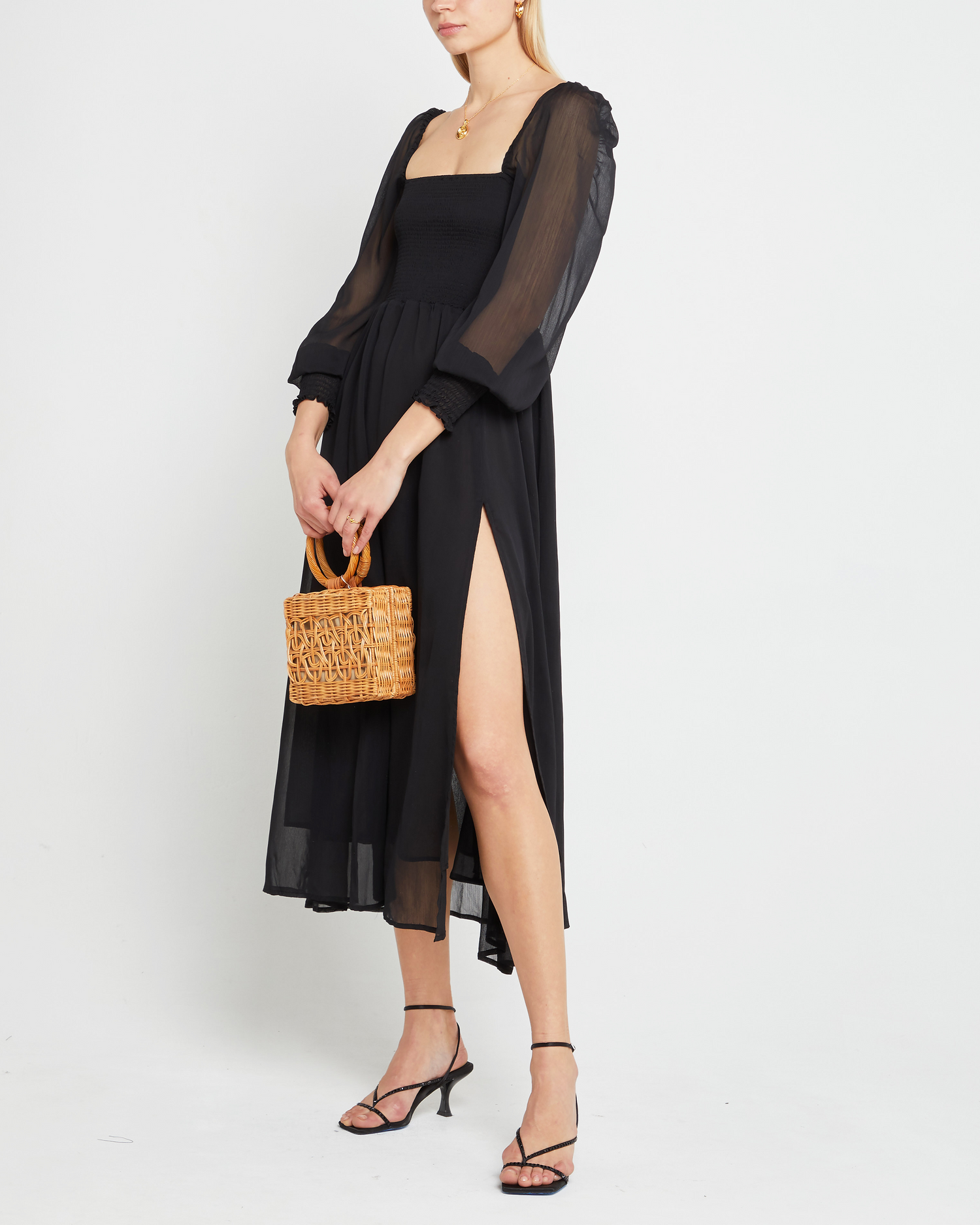 Fifth image of Classic Smocked Maxi Dress, a black maxi dress, side slit, long, sheer sleeves, puff sleeves, suqare neckline, smocke bodice
