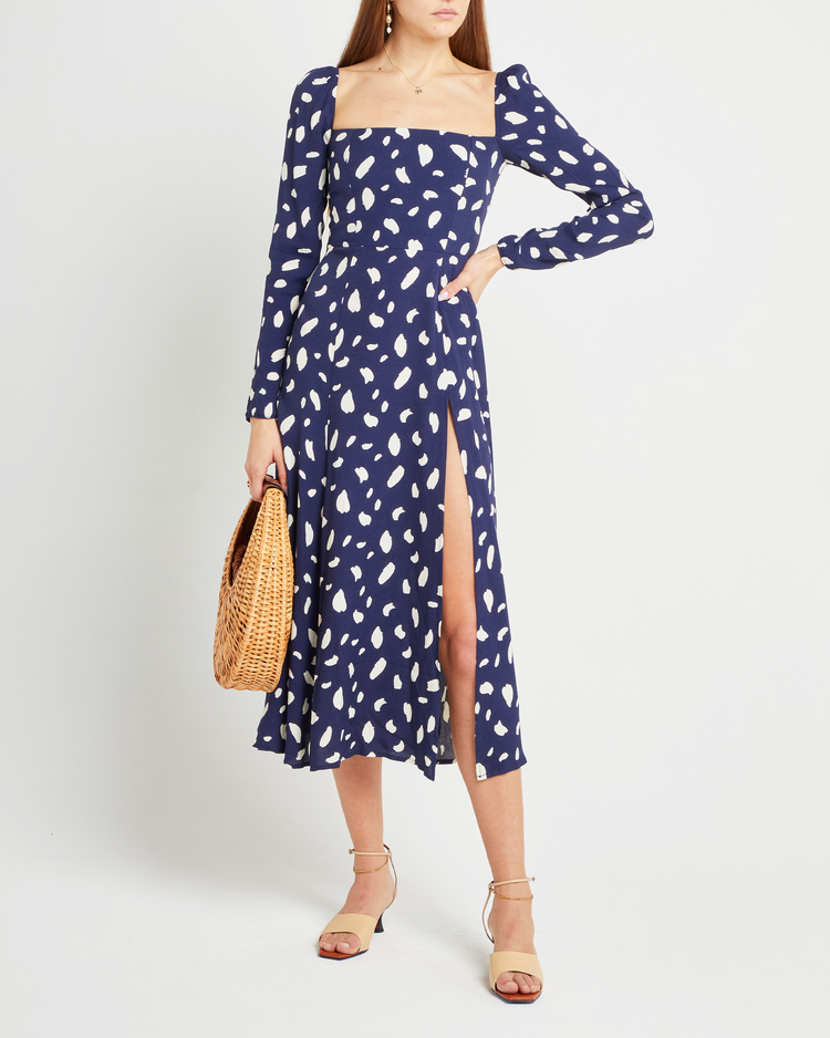 Fifth image of Lenon Dress, a midi dress, side skirt slit, long sleeves, square neckline, blue material with white irregular dots