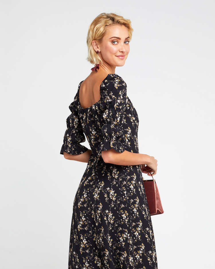 Fifth image of She's Picky Dress, a black midi dress, puff sleeves, 3/4 sleeves, fall, floral, side slit
