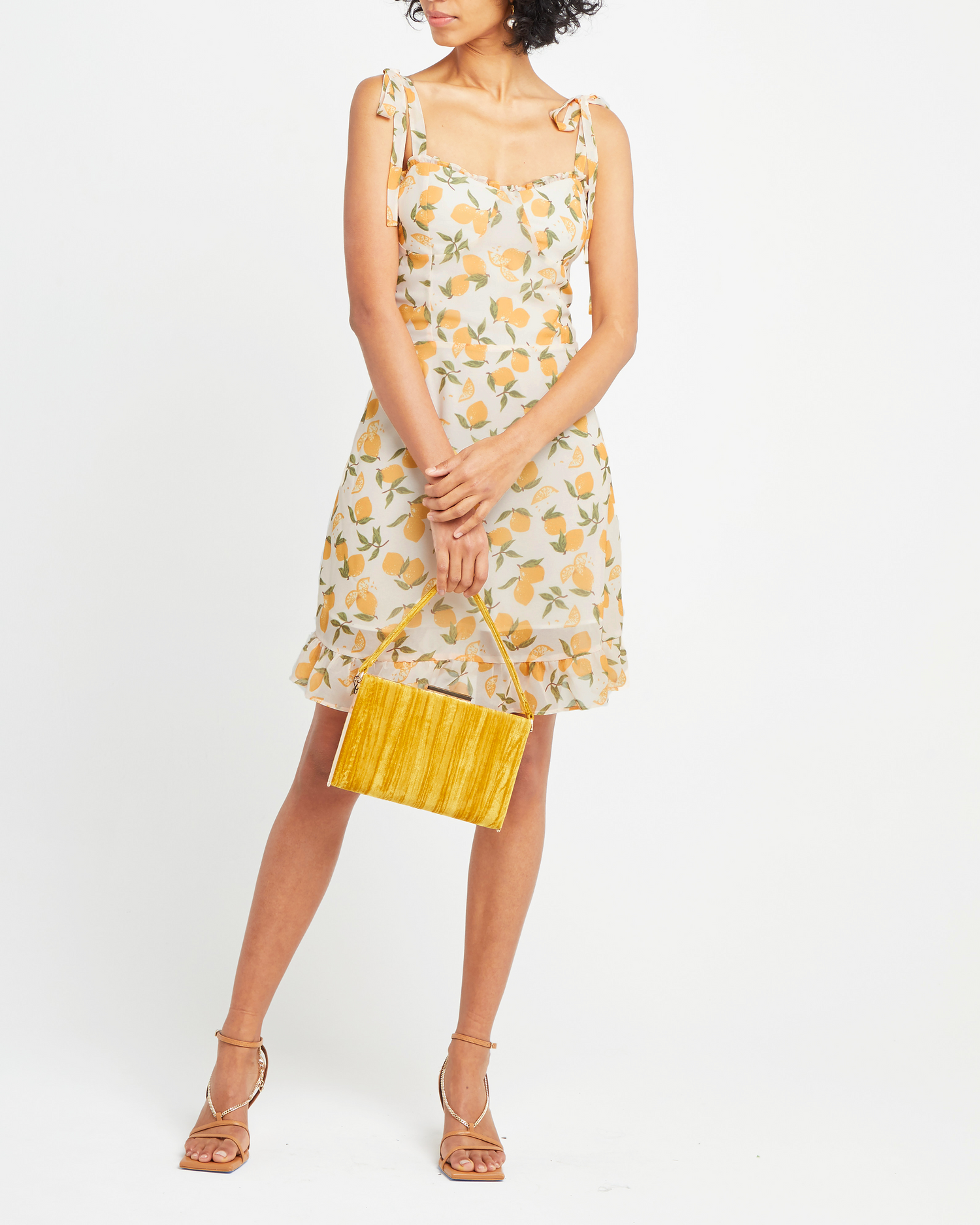 Fifth image of Sunny Dress, a yellow mini dress, ruffle, ribbon, tie straps, ribbon, bows, lemon print