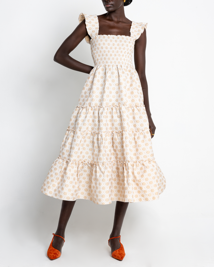 Fifth image of Calypso Maxi Dress, a white maxi dress, ruffle cap sleeves, smocked bodice, gold, floral