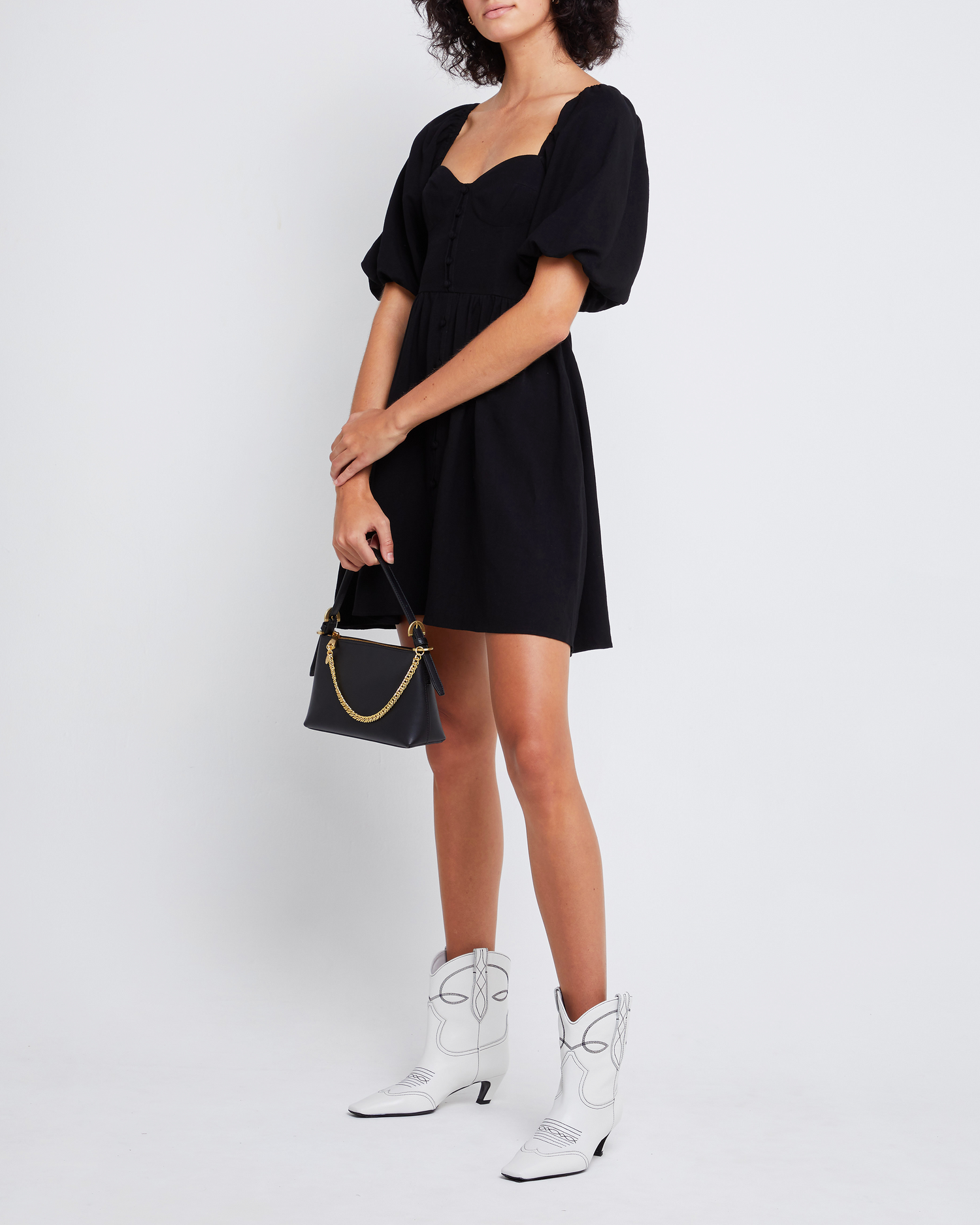 Fourth image of Esperanza Mini Dress, a black mini dress, sweetheart neckline, midi sleeves, 3/4 sleeves, puff sleeves, A-line