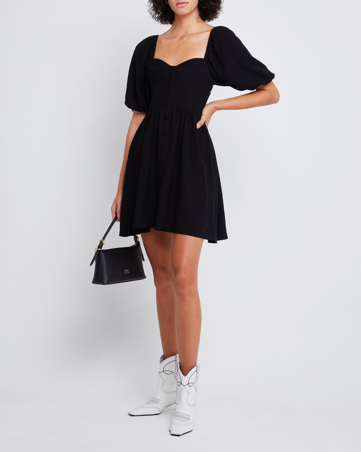 First image of Esperanza Mini Dress, a black mini dress, sweetheart neckline, midi sleeves, 3/4 sleeves, puff sleeves, A-line