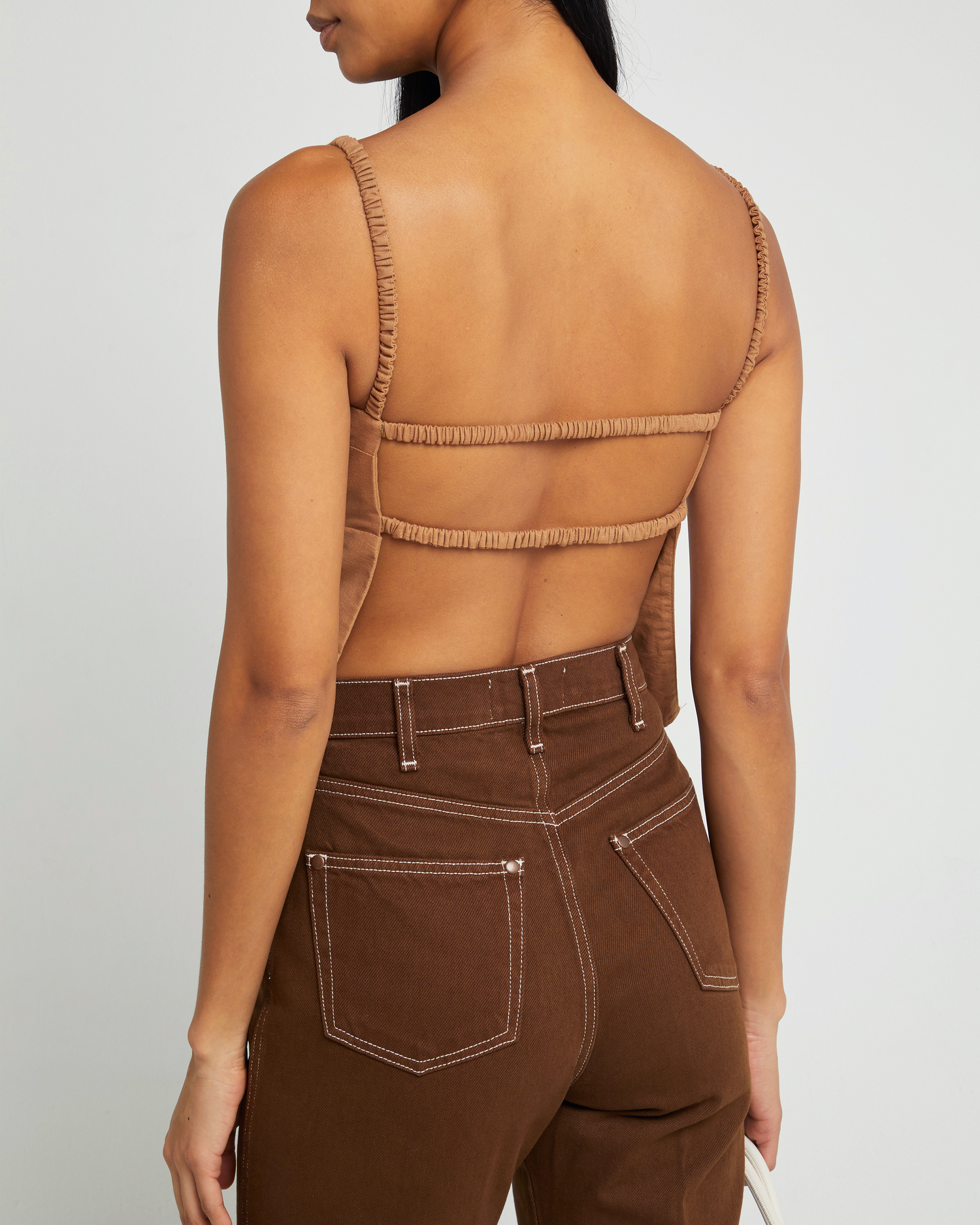 Sixth image of Carina Tank, a brown sleeveless top, open back, two elastic straps across back, thin elastic straps