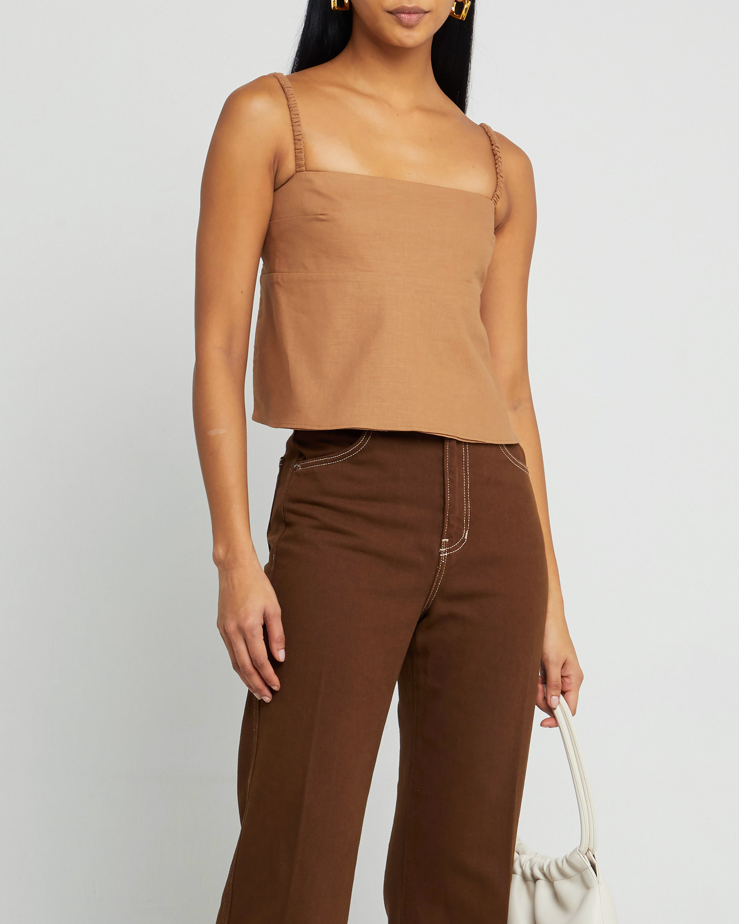 Second image of Carina Tank, a brown sleeveless top, open back, two elastic straps across back, thin elastic straps