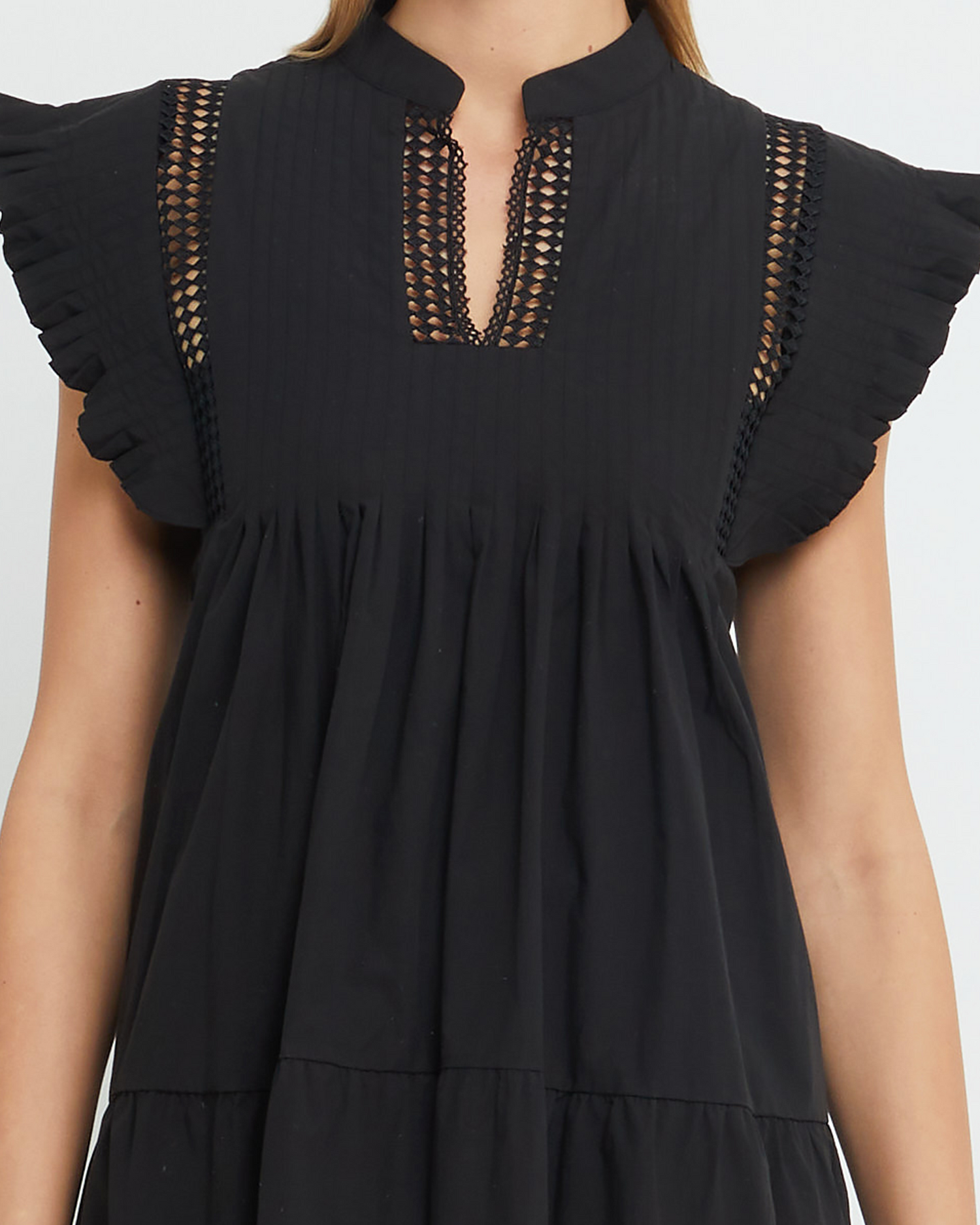 Sixth image of Callan Dress, a black mini dress, paneled, lace, ruffle sleeve, high neckline