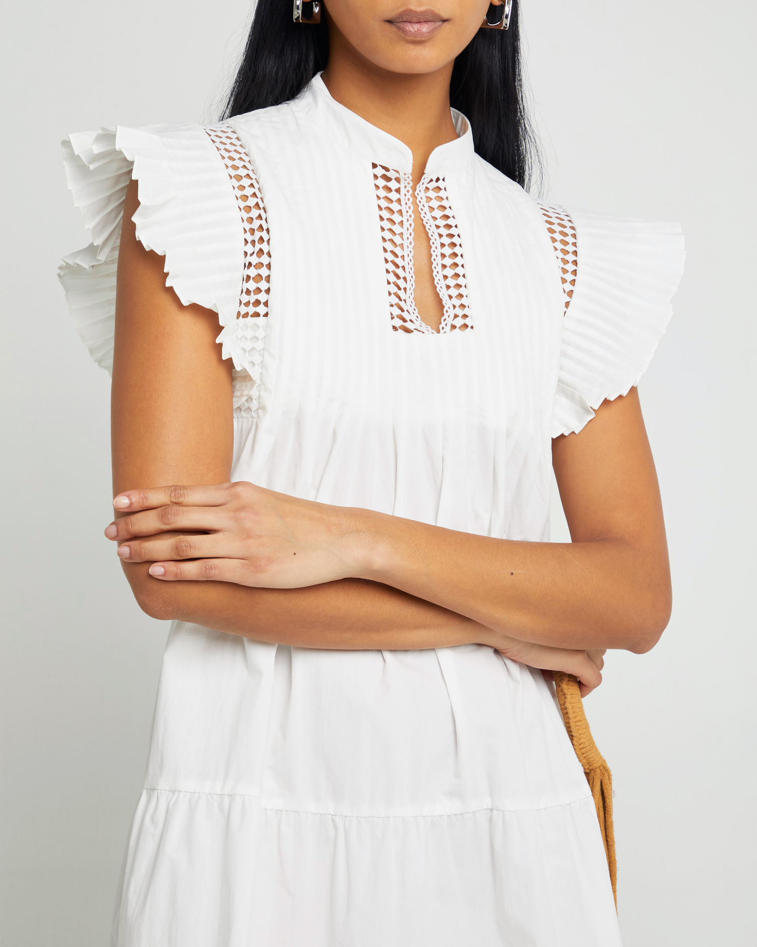 Sixth image of Callan Dress, a white mini dress, lace detail, ruffle cap sleeves, panel, pleats