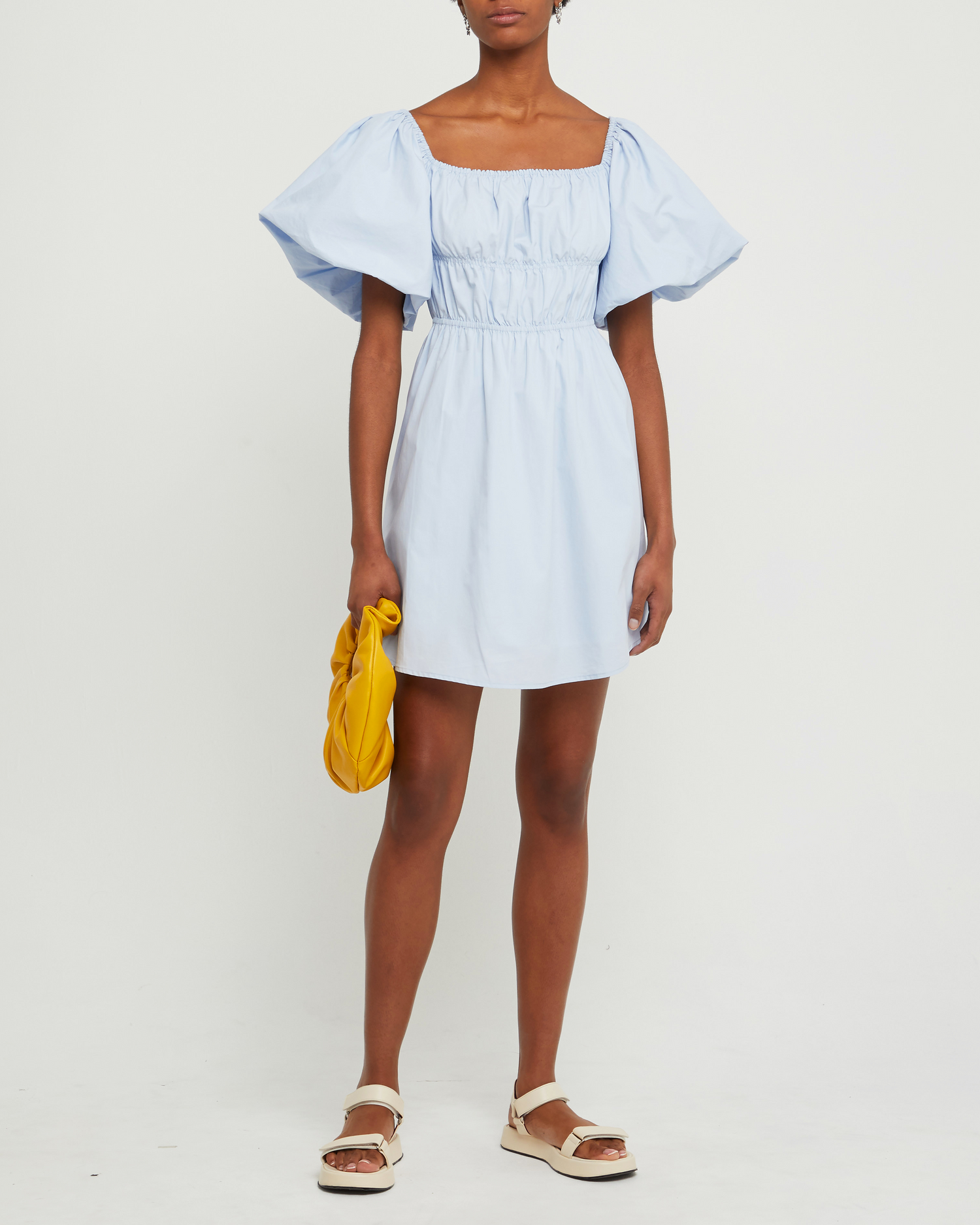 First image of Leanna Cotton Dress, a blue mini dress, puff sleeves, gathered bodice, short sleeve