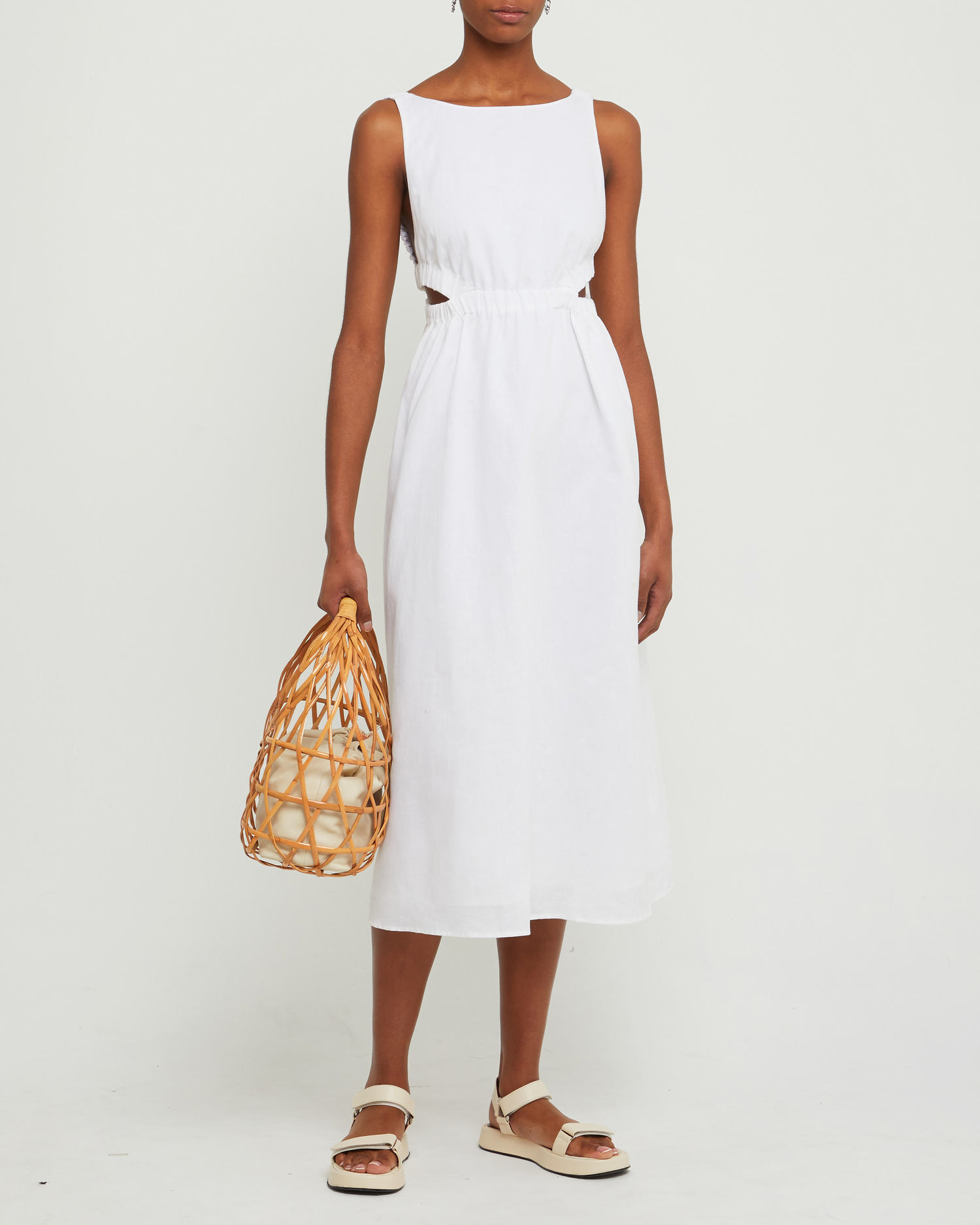 First image of Aubrielle Dress, a white midi dress, open back, cut out, high neckline, sleeveless