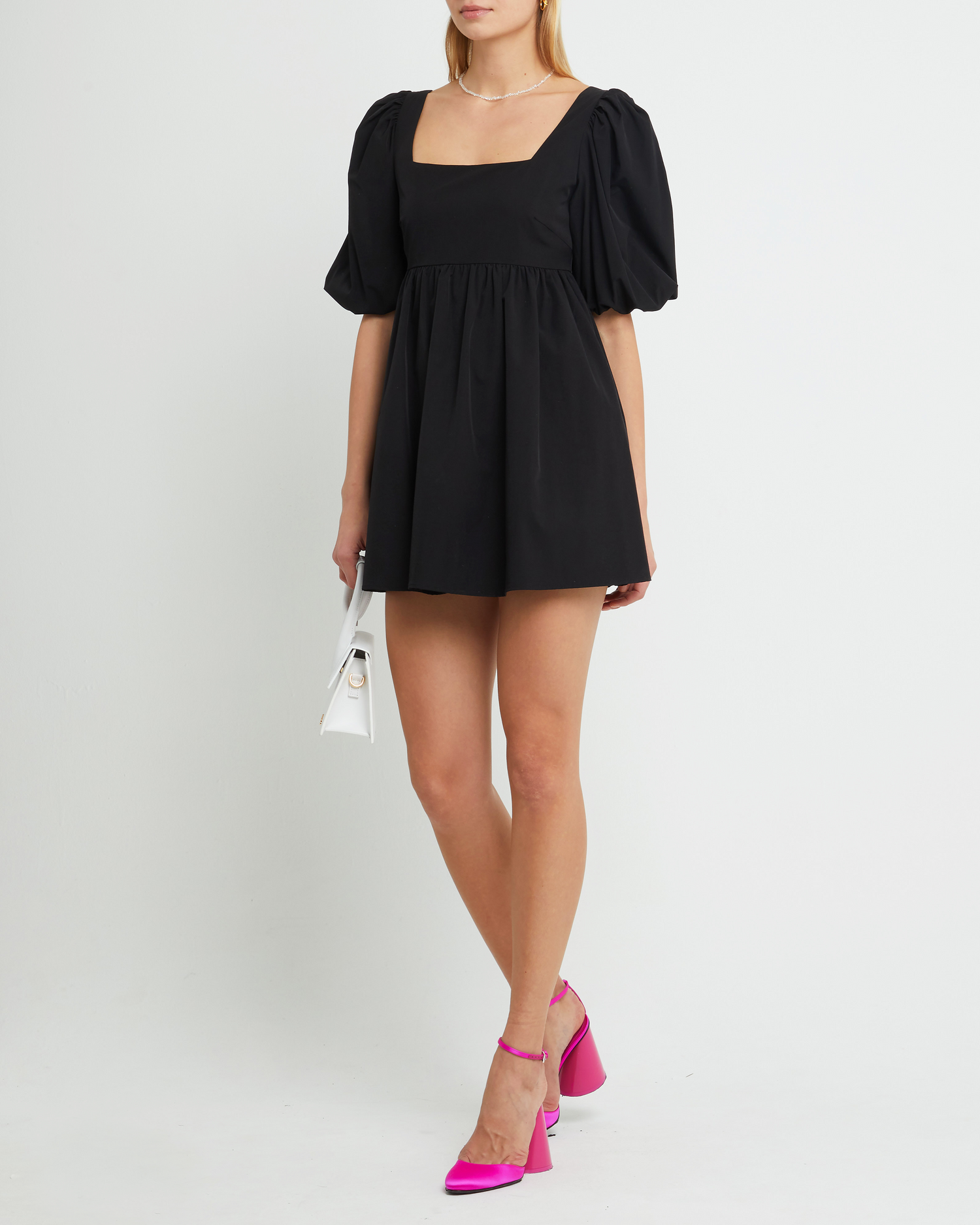 Fourth image of Adley Dress, a black mini dress, open back, back tie, babydoll, puff sleeves, ribbon, bows