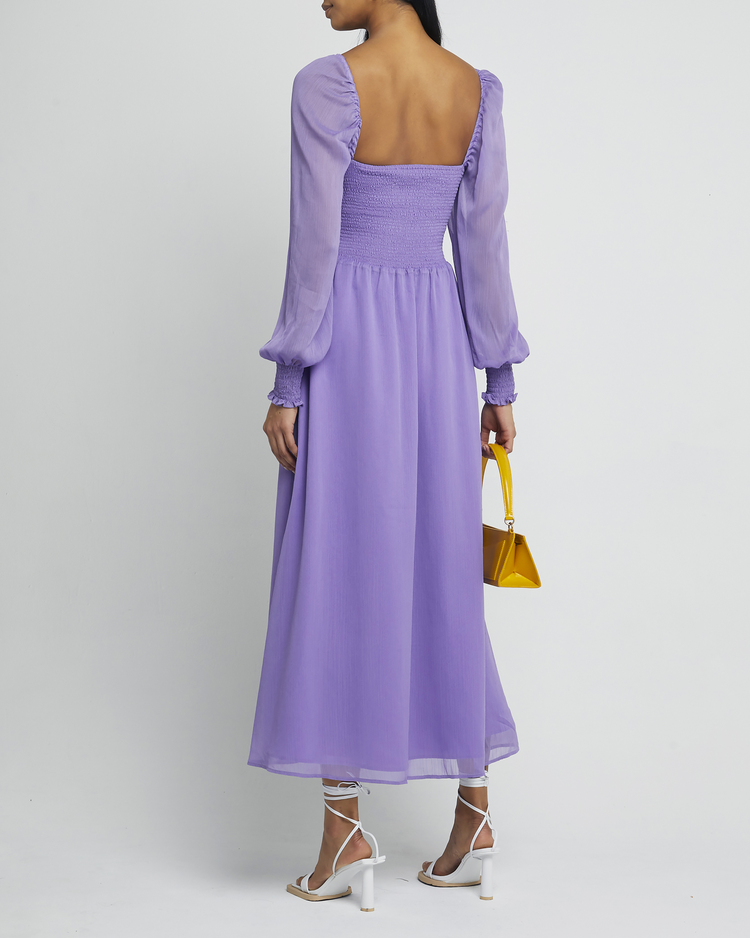 Second image of Classic Smocked Maxi Dress, a purple maxi dress, side slit, long, sheer sleeves, puff sleeves, square neckline, smocked bodice