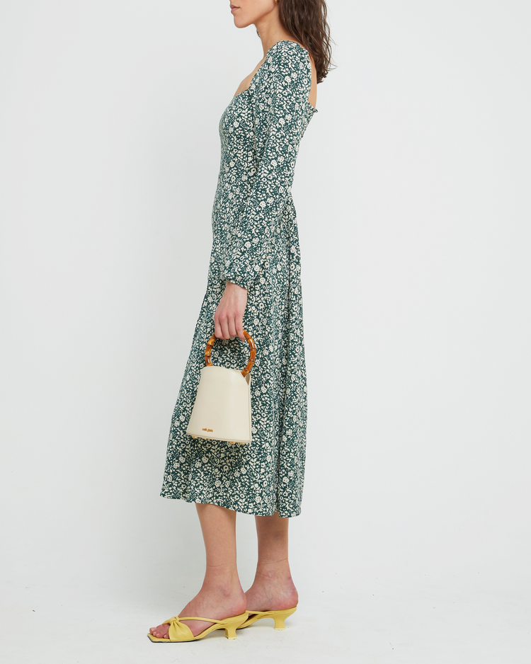 Third image of Lenon Dress, a green midi dress, side skirt slit, long sleeves, square neckline