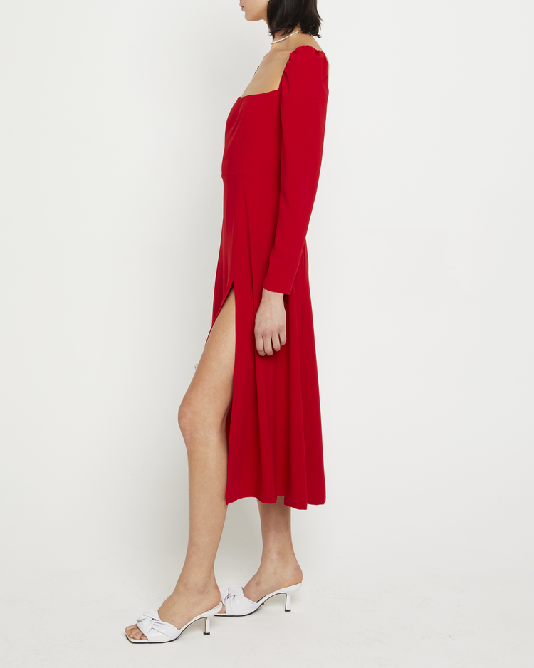 Third image of Lenon Dress, a red midi dress, side skirt slit, long sleeves, square neckline