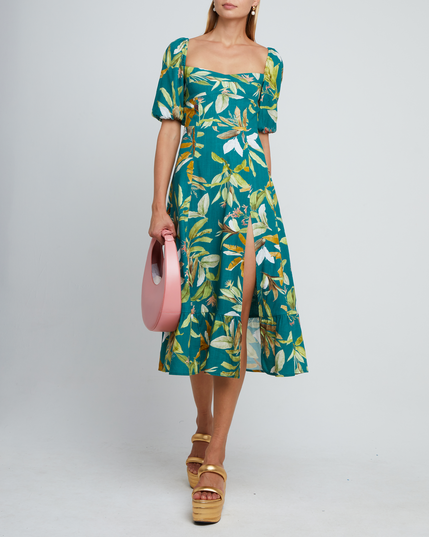 First image of Violetta Midi Dress, a green midi dress, sweetheart neckline, short sleeves, puff sleeves, side slit, tropical print, floral