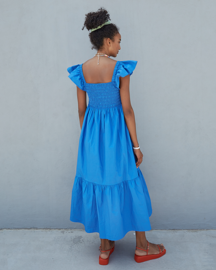 Second image of Tuscany Dress, a blue maxi dress, smocked bodice, ruffled cap sleeves, pockets