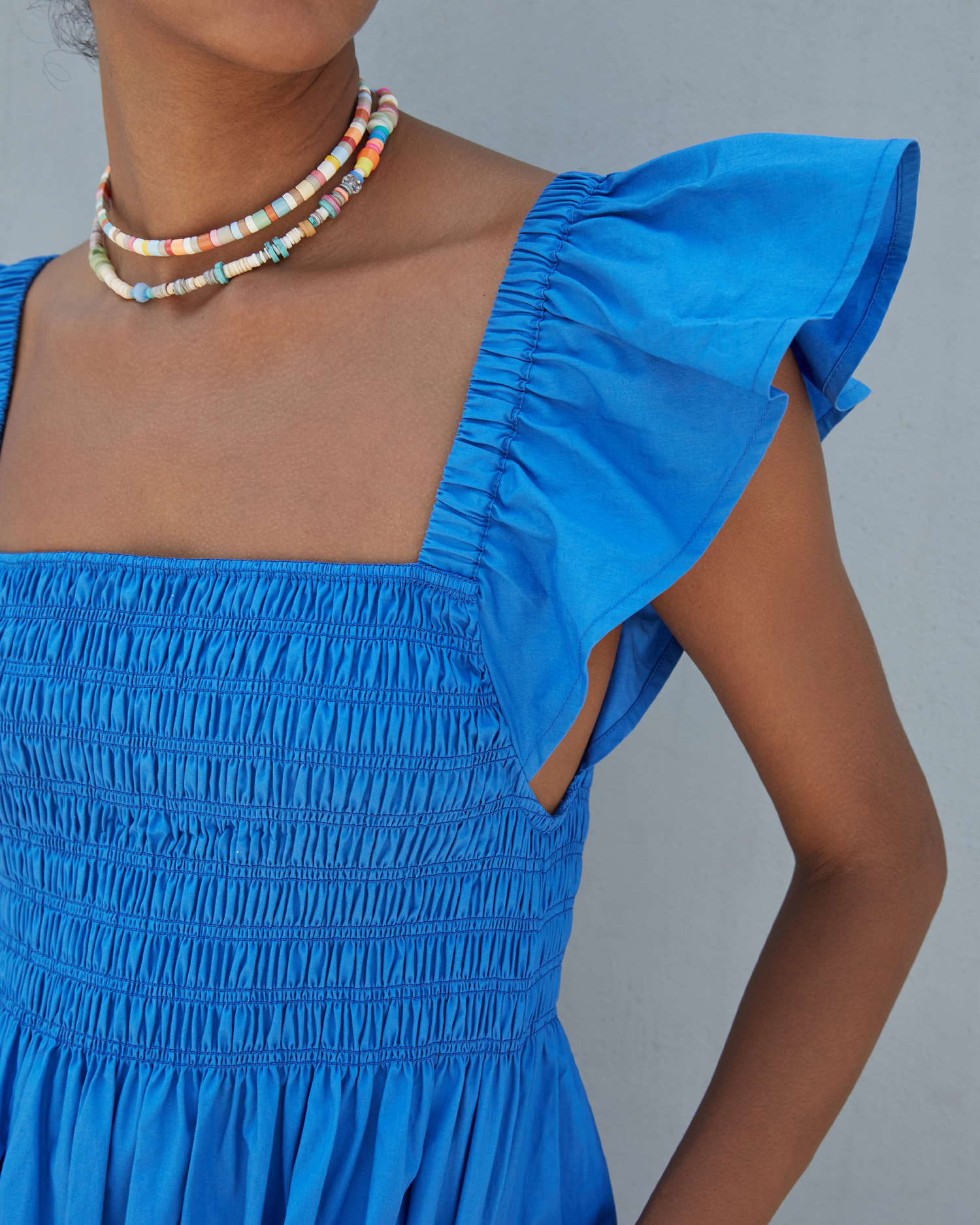 Sixth image of Tuscany Dress, a blue maxi dress, smocked bodice, ruffled cap sleeves, pockets