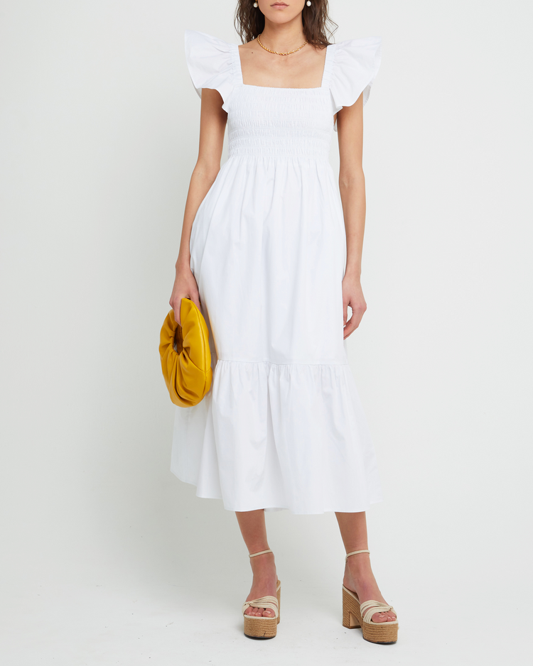 First image of Tuscany Dress, a white maxi dress, smocked bodice, ruffled cap sleeves, pockets