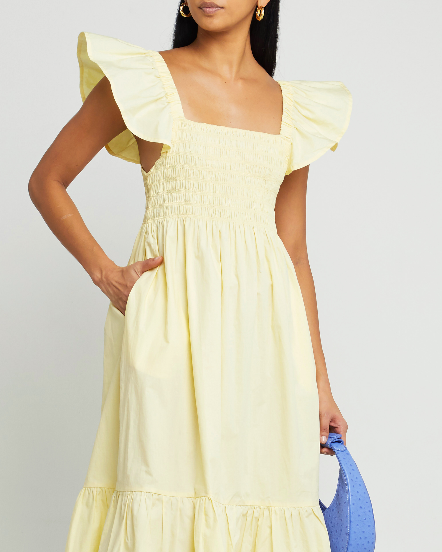 Sixth image of Tuscany Dress, a yellow midi dress, smocked bodice, ruffled cap sleeves, pockets