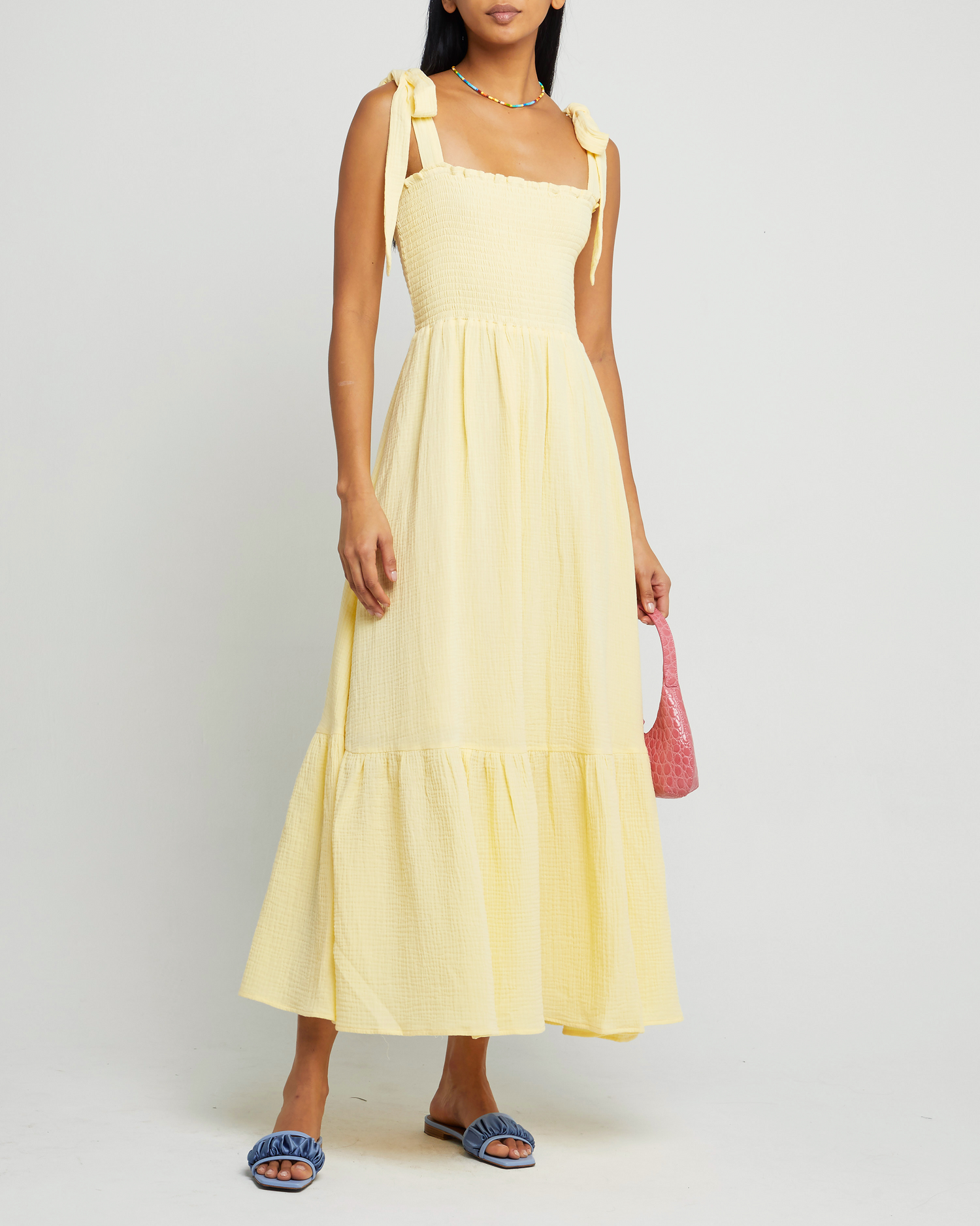 First image of Cotton Winnie Dress, a yellow maxi dress, tie straps, smocked bodice