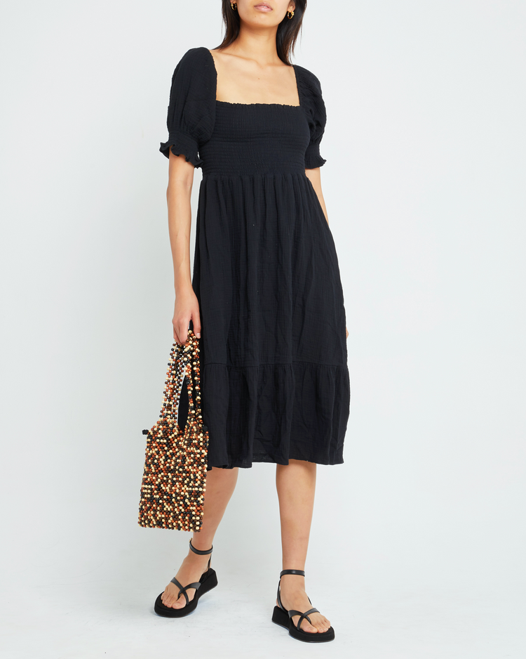 Fifth image of Angie Dress, a black midi dress, puff sleeves, smocked bodice, square neckline