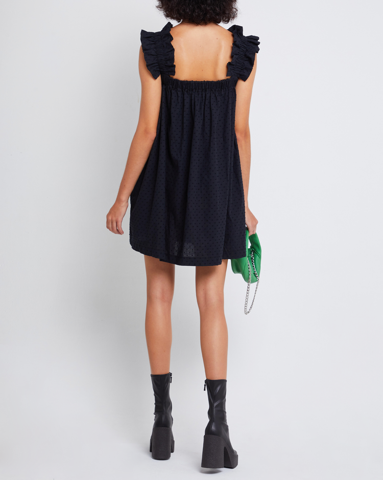 Second image of Nivia Dress, a black mini dress, ruffle sleeves, cap sleeves, flowy, relaxed