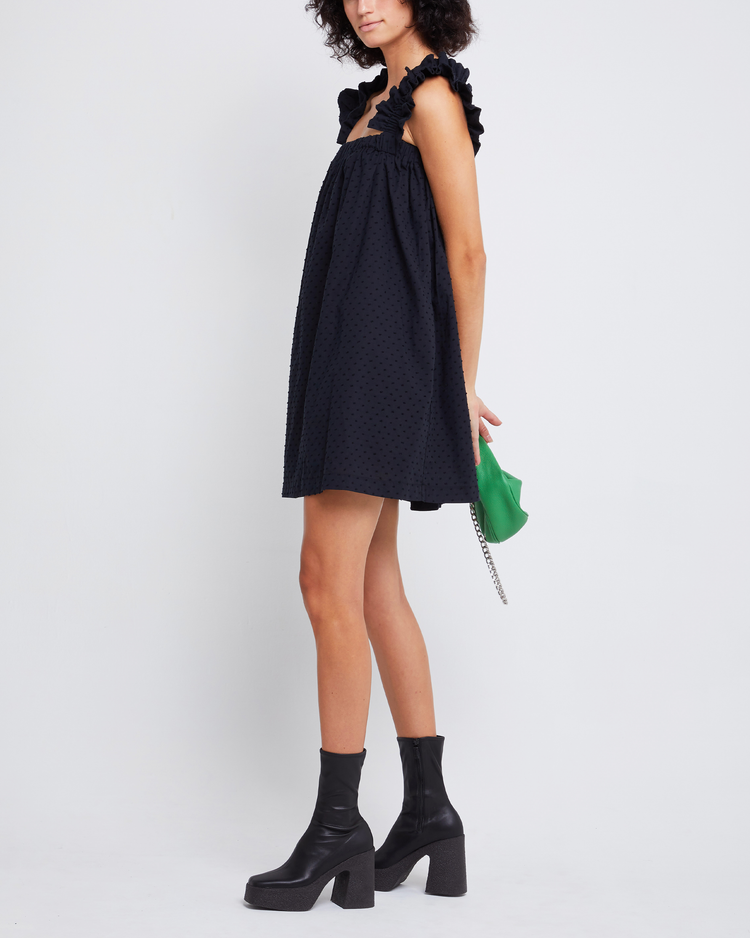 Fifth image of Nivia Dress, a black mini dress, ruffle sleeves, cap sleeves, flowy, relaxed