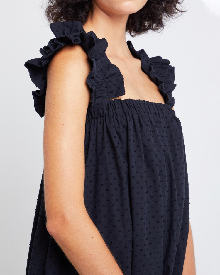 Sixth image of Nivia Dress, a black mini dress, ruffle sleeves, cap sleeves, flowy, relaxed