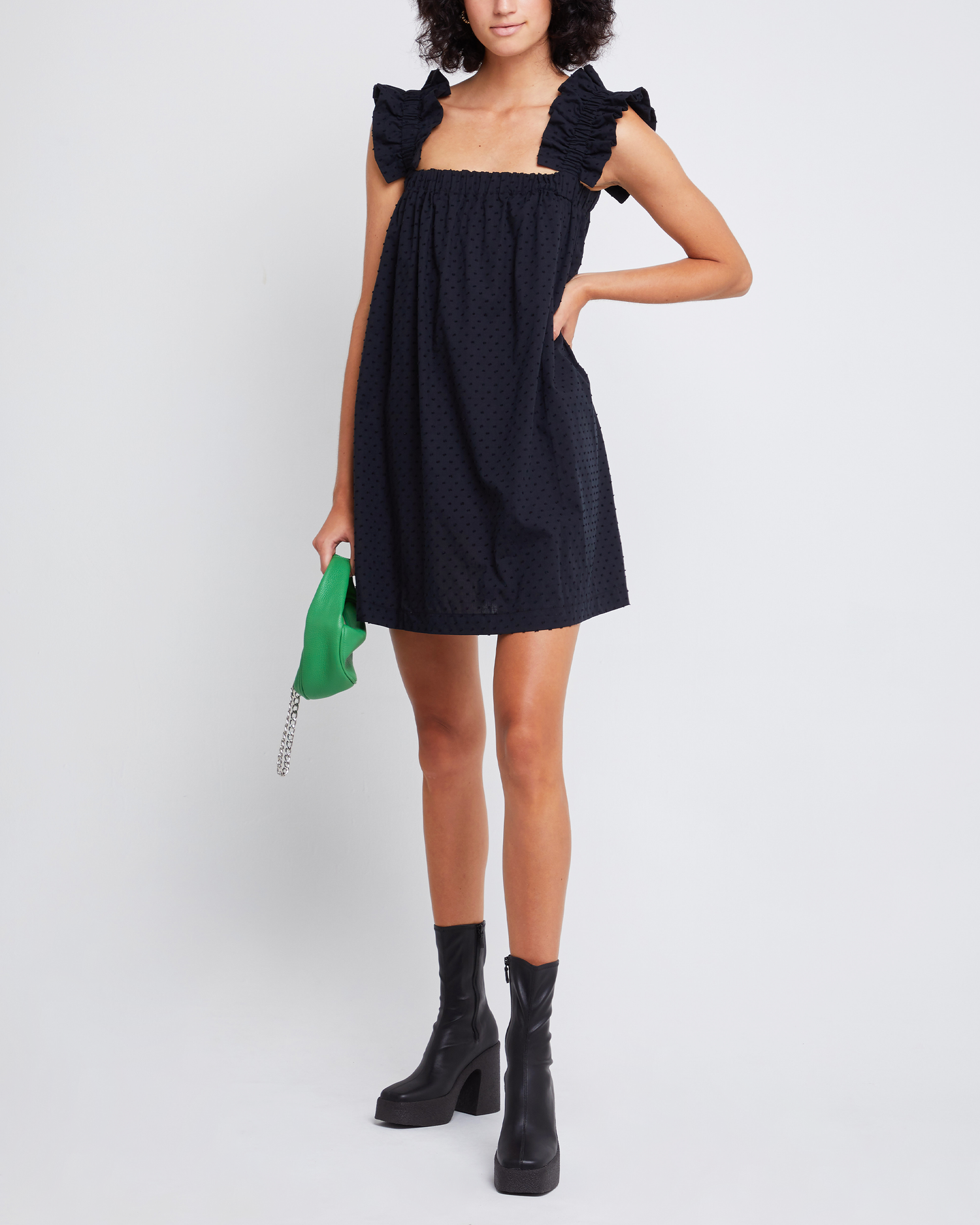 Fourth image of Nivia Dress, a black mini dress, ruffle sleeves, cap sleeves, flowy, relaxed