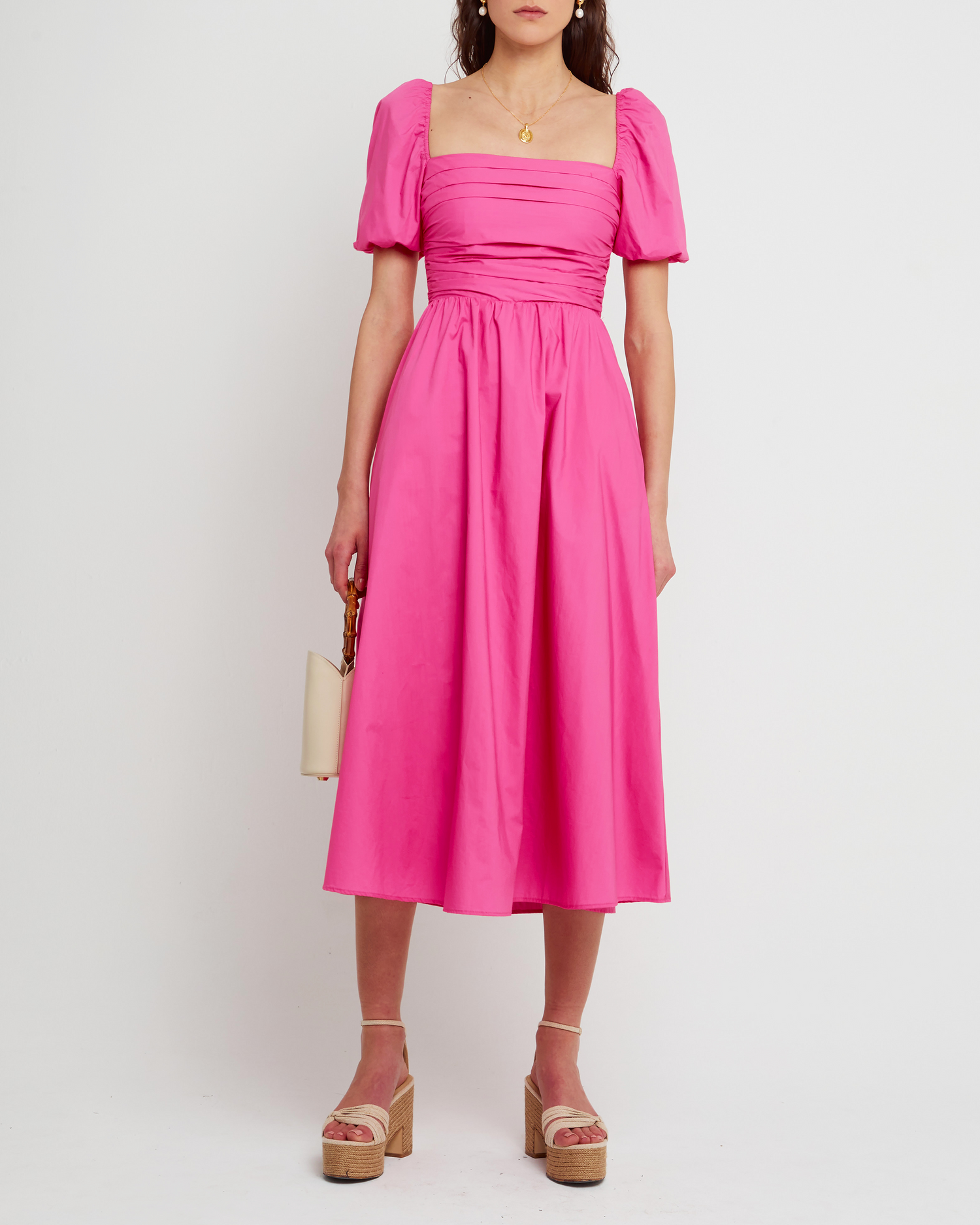 First image of River Dress, a pink midi dress, square neckline, short puff sleeves, gathered bodice