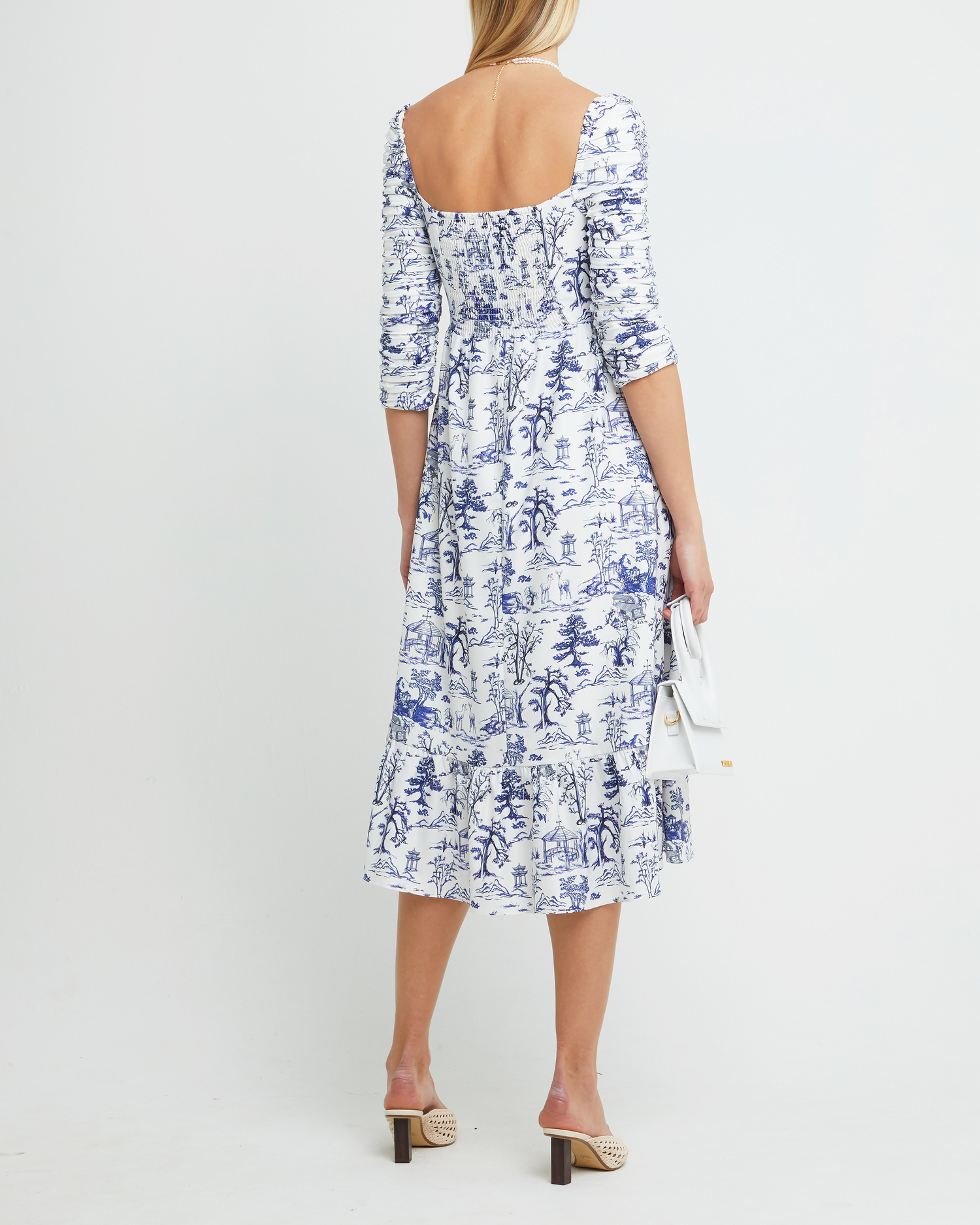 Second image of Bonnie Dress, a blue midi dress, toile, pockets, ruched sleeves, square neckline, long sleeves, 3/4 sleeves