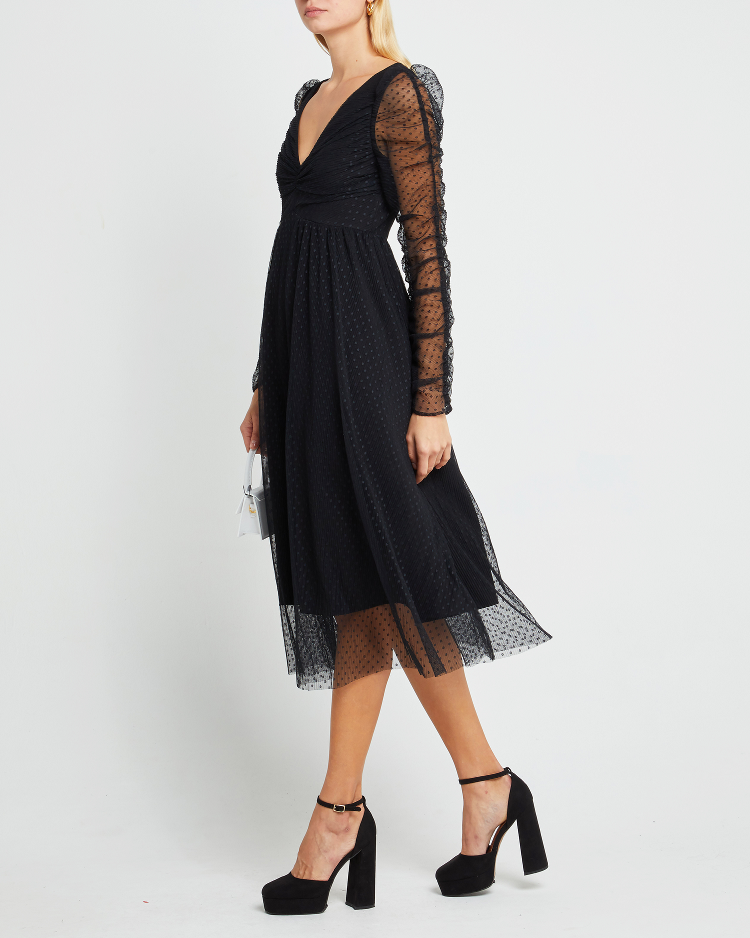 Third image of Daisy Dress, a black wedding guest dress with sheer long sleeves, v-neckline, ruched gathered bust detail, cinched waist, lining, dotted mesh fabric, and back zipper