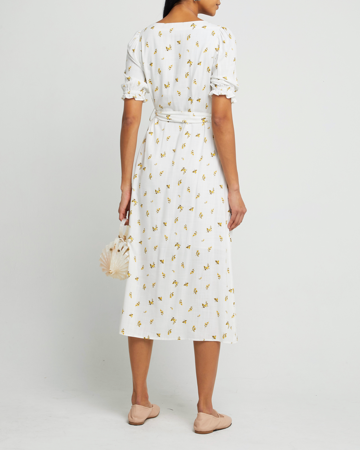 Second image of Juni Dress, a white maxi dress, short sleeve, waist tie, white print