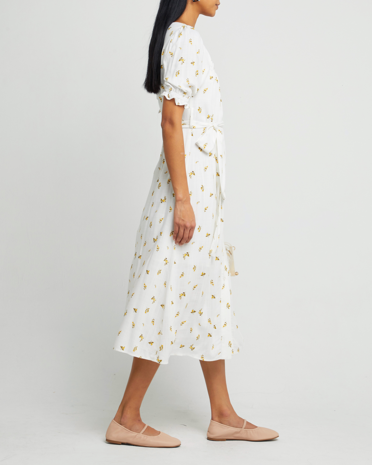 Third image of Juni Dress, a white maxi dress, short sleeve, waist tie, white print