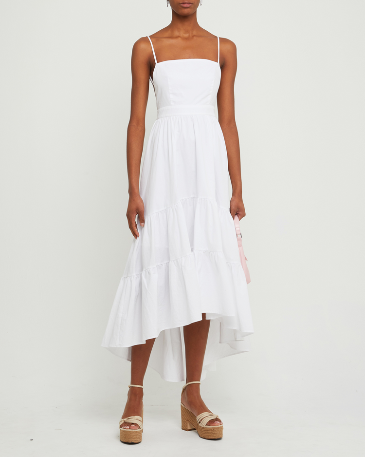 First image of Dionne Cotton Dress, a white midi dress, spaghetti straps, high-low, high low skirt, maxi