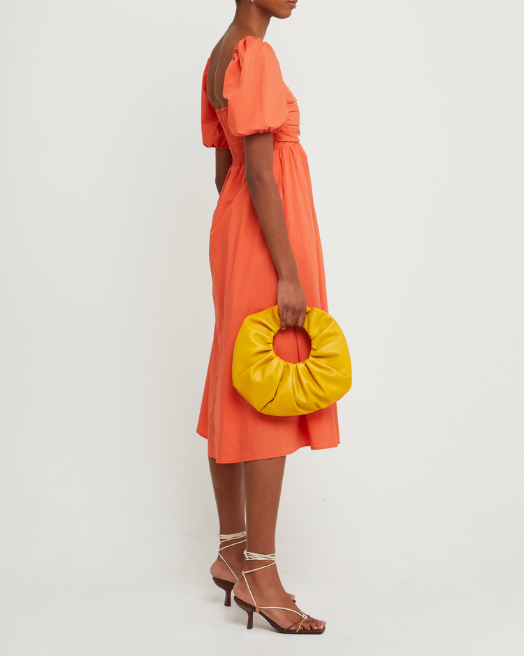 Third image of River Dress, a orange midi dress, square neckline, short puff sleeves, gathered bodice